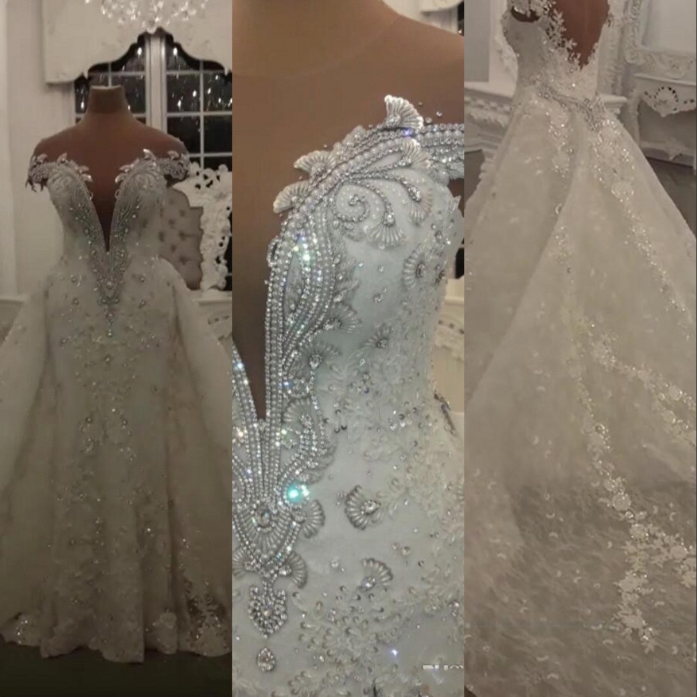 2023 Luxury African Mermaid Wedding Dresses Formal Bridal Dress Crystal Beads Off Shoulder Deep V Neck Lace Overskirts Detachable Train vestido de noiva Cap Sleeves, Ivory
2023 Luxury African Mermaid Wedding Dresses Formal Bridal Dress Crystal Beads Off Shoulder Deep V Neck Lace Overskirts Detachable Train vestido de noiva Cap Sleeves, Ivory