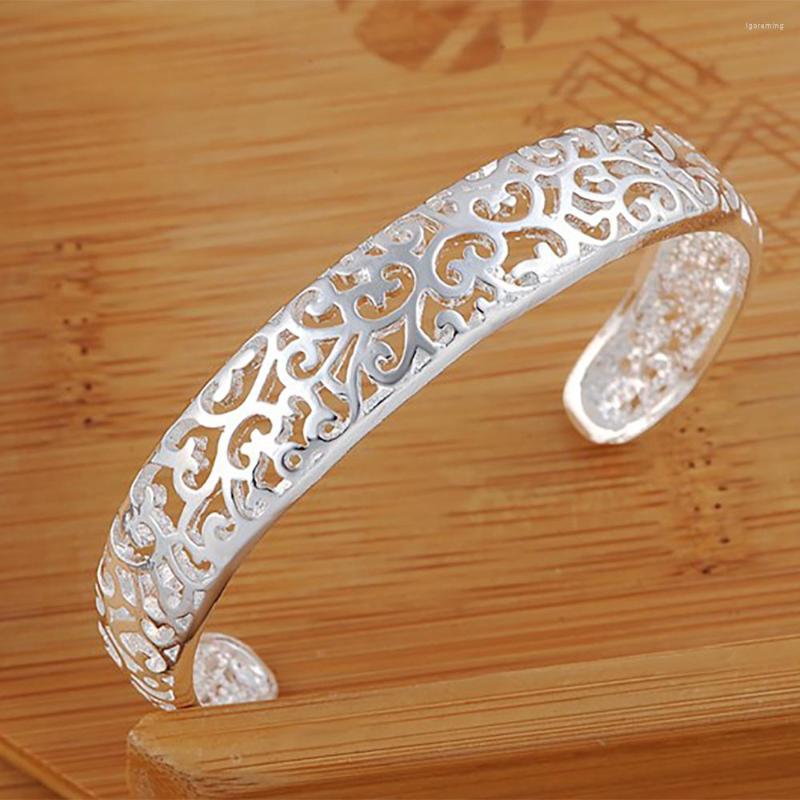 Bangle 925 Stamp Silver Color Women's Hollow Flower Adjustable Cuff Bangles Bracelet On Hand Luxury Engagement Party Charm Jewelry
Bangle 925 Stamp Silver Color Women's Hollow Flower Adjustable Cuff Bangles Bracelet On Hand Luxury Engagement Party Charm Jewelry