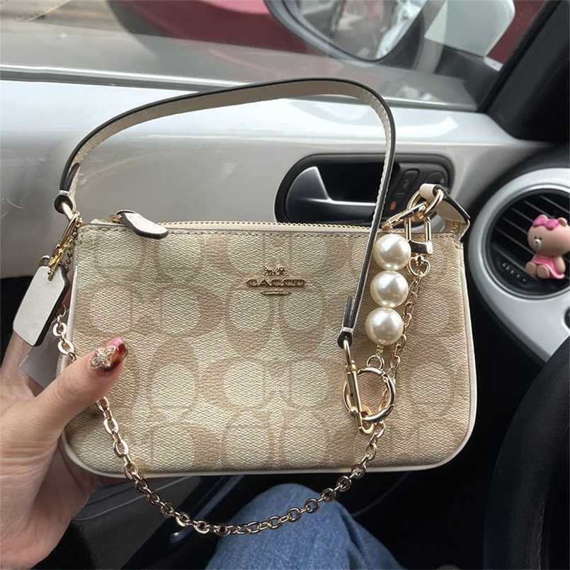 Designer Coech Women Handbags Fashion luxury leather Mini mahjong 2022 new pearl chain small armpit mobile phone, Creamy-white
Designer Coech Women Handbags Fashion luxury leather Mini mahjong 2022 new pearl chain small armpit mobile phone, Creamy-white