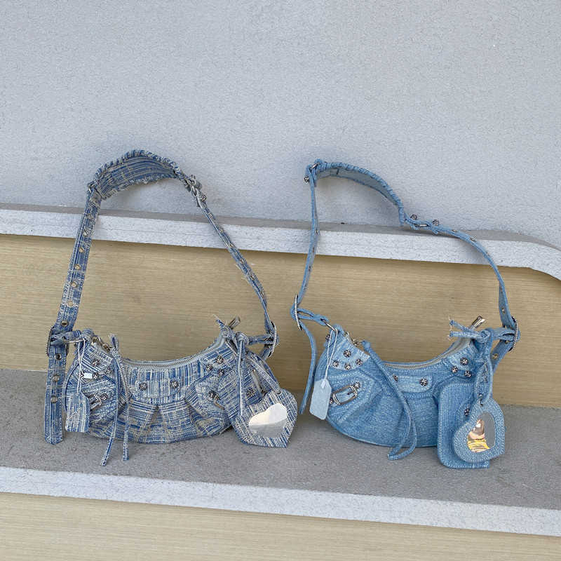 AHer Max Design leather Balenicass biker bag 2023 diamond inlaid denim motorcycle rivet hot girl half moon ancient armpit three in one shoulder cross body, Denim light blue
AHer Max Design leather Balenicass biker bag 2023 diamond inlaid denim motorcycle rivet hot girl half moon ancient armpit three in one shoulder cross body, Denim light blue
