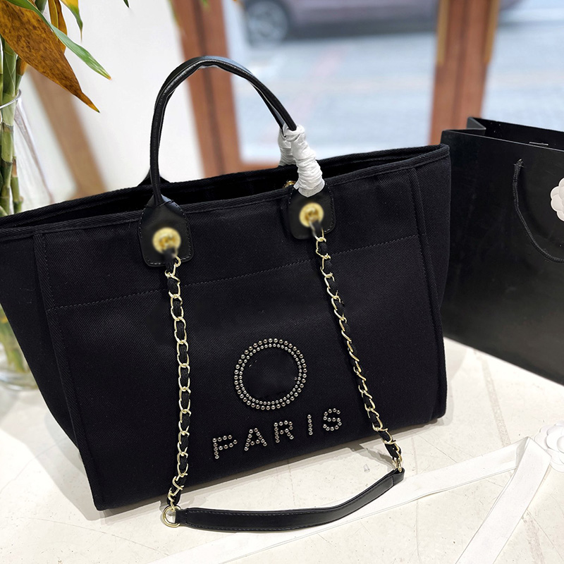 Womens Designer Pearl Canvas Beach Shopping Bags Deauville Clutch With Chain Top Handle Totes Gold Metal Chain Shoulder Pocket Large Capacity Handbags 37X29CM, Black
Womens Designer Pearl Canvas Beach Shopping Bags Deauville Clutch With Chain Top Handle Totes Gold Metal Chain Shoulder Pocket Large Capacity Handbags 37X29CM, Black