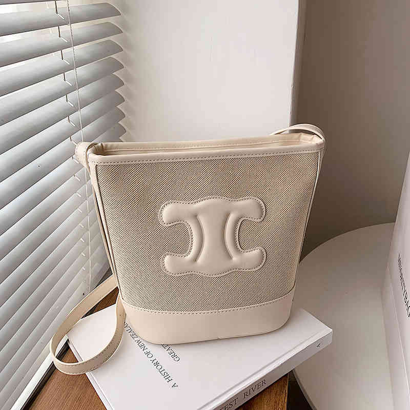 Small design bag Women's 2022 Summer New Korean Versatile Canvas Bag Crossbody Contrast One Shoulder Bucket, White
Small design bag Women's 2022 Summer New Korean Versatile Canvas Bag Crossbody Contrast One Shoulder Bucket, White