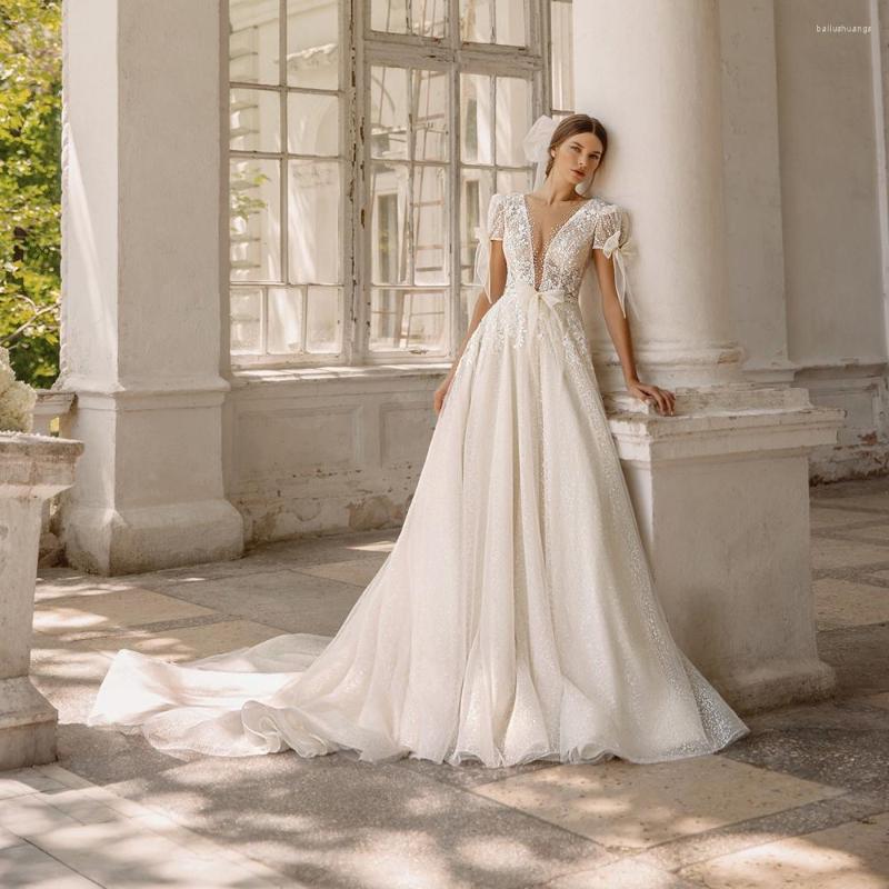 Wedding Dress UETEEY Sparkly Lace Tulle Dresses See-Through Deep V-Neck Short Sleeve Bow Open Back Gowns 2022 Vestido Feminino, White
Wedding Dress UETEEY Sparkly Lace Tulle Dresses See-Through Deep V-Neck Short Sleeve Bow Open Back Gowns 2022 Vestido Feminino, White