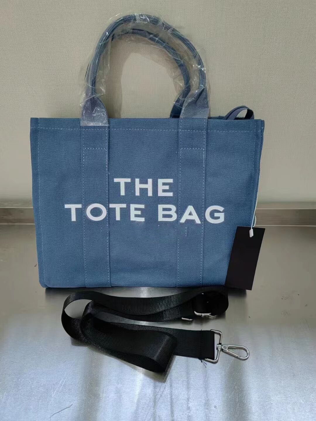 the tote Bag Marc totes bag Women designer Bags handbag Fashion all-match Shopper Shoulder Canvas Handbags Size 25/12/22CM
the tote Bag Marc totes bag Women designer Bags handbag Fashion all-match Shopper Shoulder Canvas Handbags Size 25/12/22CM