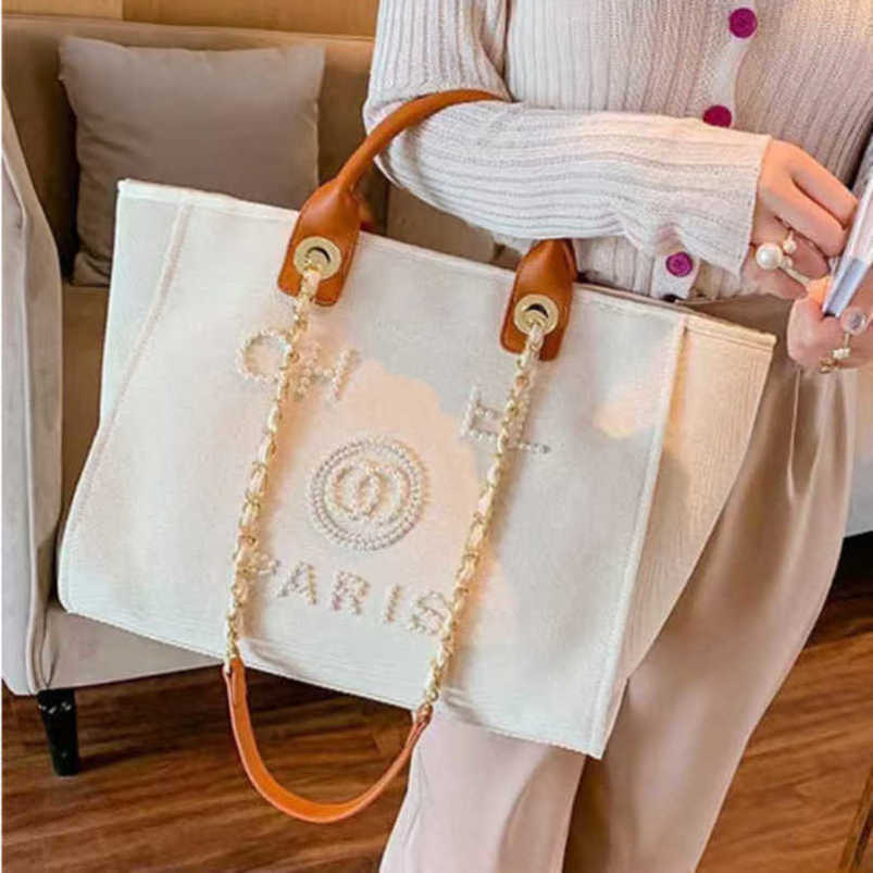 Fashion Women's Luxury Evening Bags Ch Brand Canvas Handbag Classic Pearl Beach Hand Bag Designer Female Large Backpack Small Packs Portable Shopping Handbags Y5jv
Fashion Women's Luxury Evening Bags Ch Brand Canvas Handbag Classic Pearl Beach Hand Bag Designer Female Large Backpack Small Packs Portable Shopping Handbags Y5jv
