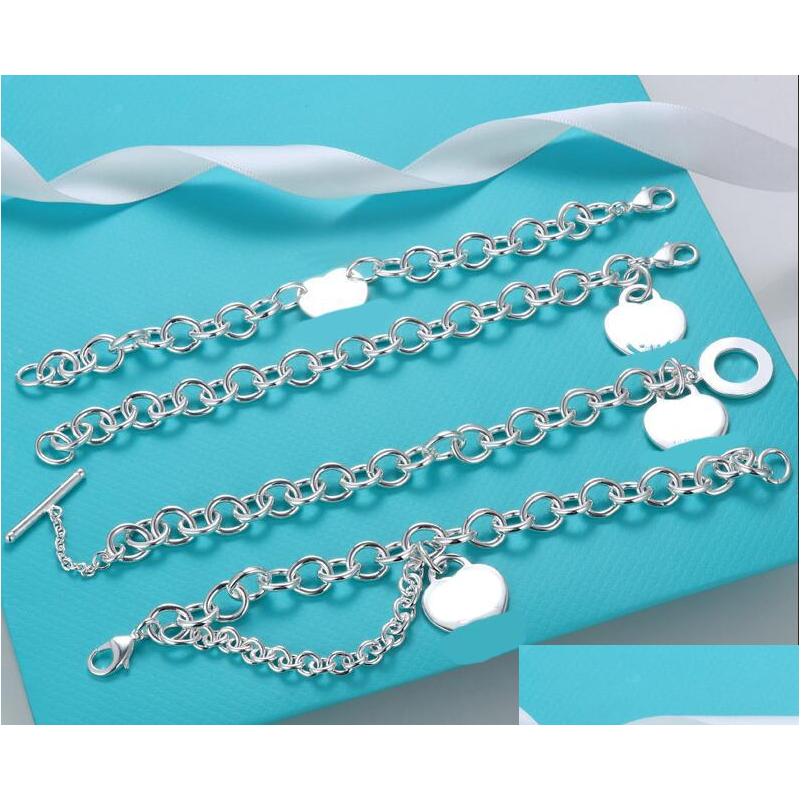 Charm Bracelets Tiff Tanys Designer Steel Seal Letterheartshaped English Tag Bracelet High Quality Lock Chain Metal Texture S925 Sie Dhfyg
Charm Bracelets Tiff Tanys Designer Steel Seal Letterheartshaped English Tag Bracelet High Quality Lock Chain Metal Texture S925 Sie Dhfyg