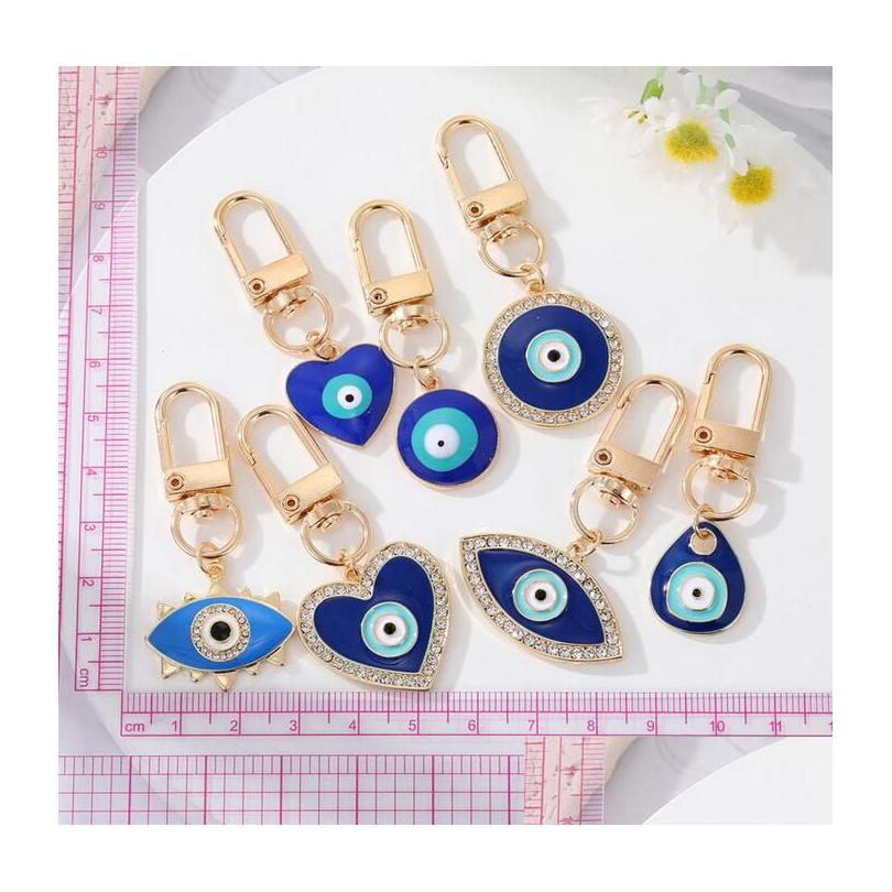 Key Rings Water Drop Heart Blue Evil Eyes Key Rings Keychain Fashion Lucky Turkish Eye Ring Diy Keychains Car Chains Holder Accessor Dhe6T
Key Rings Water Drop Heart Blue Evil Eyes Key Rings Keychain Fashion Lucky Turkish Eye Ring Diy Keychains Car Chains Holder Accessor Dhe6T