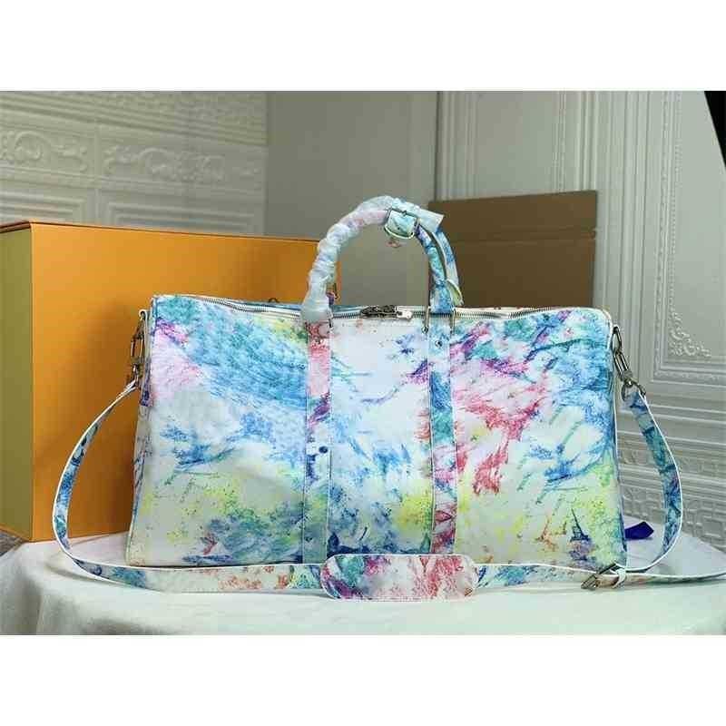 2022 luxury fashion men women travel bag duffle bags brand designer genuine leather luggage handbags large capacity sport bag
2022 luxury fashion men women travel bag duffle bags brand designer genuine leather luggage handbags large capacity sport bag