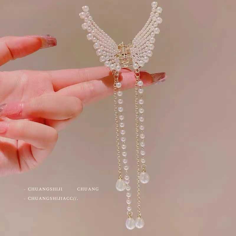 Hair Clips new fashion tassel pearl butterfly clip high sense half tie head temperament curling headdress
Hair Clips new fashion tassel pearl butterfly clip high sense half tie head temperament curling headdress