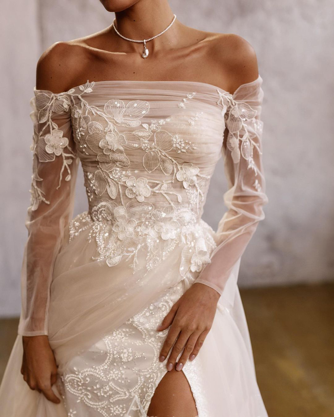 Elegant Lace Mermaid Wedding Gown with Off Shoulder Detail and High Split Tulle Skirt