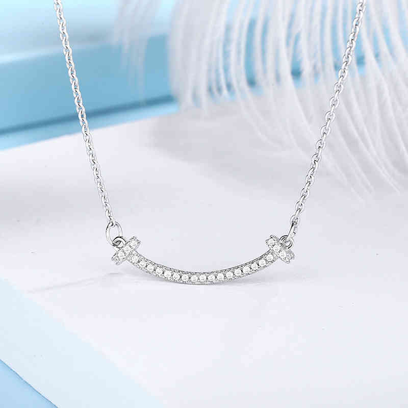 Japanese and Korean white copper Tang Jing same necklace smiling face radian clavicle chain women simple versatile fashion temperament
Japanese and Korean white copper Tang Jing same necklace smiling face radian clavicle chain women simple versatile fashion temperament