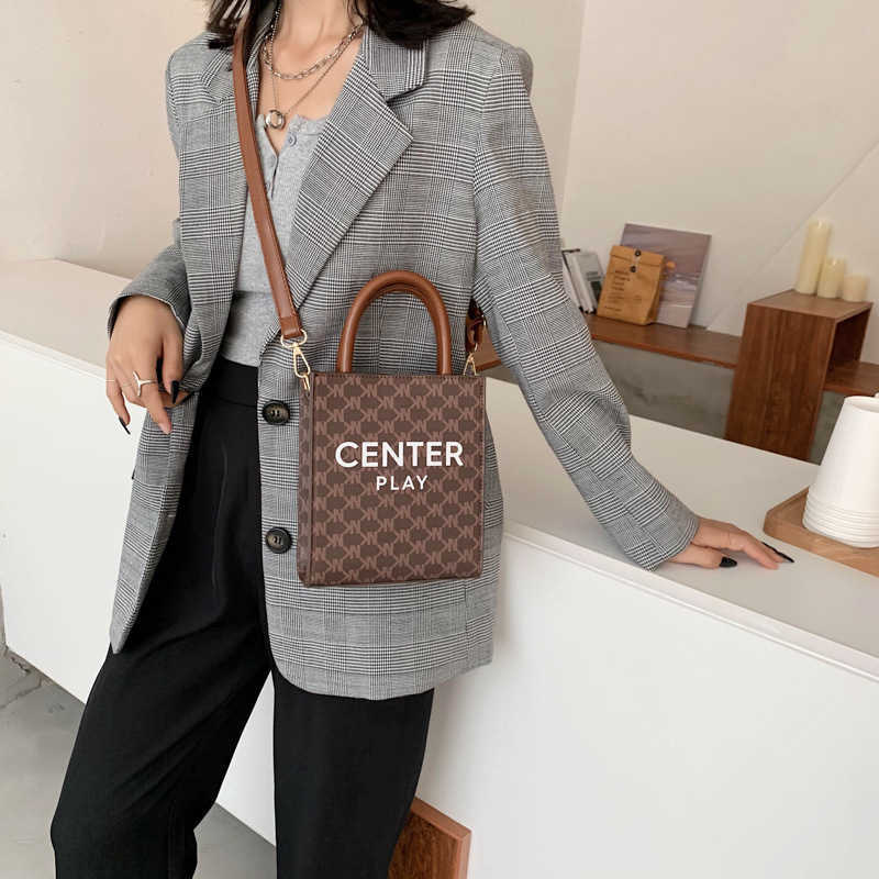 Vertical Cell Phone Canvas Line Genuine Cabas Leather Triomphe Mini Tote New Printed Letter Messenger Bag Single Shoulder Mobile Women's Tex
Vertical Cell Phone Canvas Line Genuine Cabas Leather Triomphe Mini Tote New Printed Letter Messenger Bag Single Shoulder Mobile Women's Tex