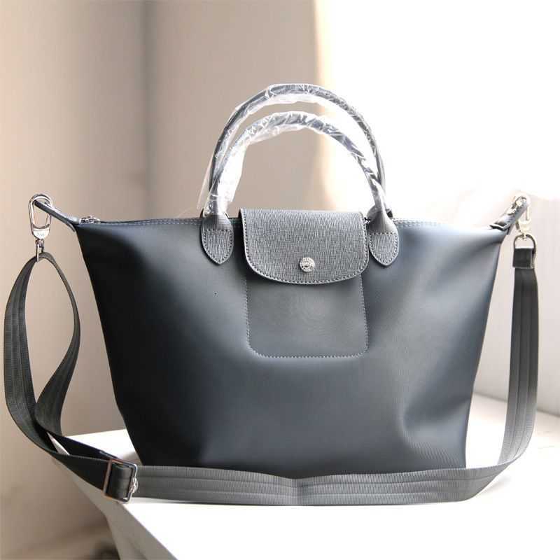 New Dumpling Bag Messenger Handheld Nylon Thickened Waterproof Large Capacity Women's purses luxury handbags, Small dark grey (with log)
New Dumpling Bag Messenger Handheld Nylon Thickened Waterproof Large Capacity Women's purses luxury handbags, Small dark grey (with log)