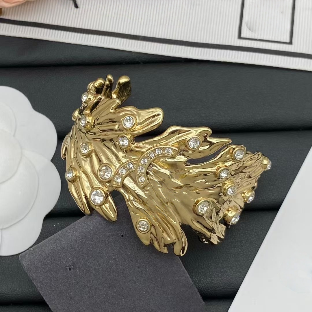 bracelet designer bracelet luxury bracelet elegant golden leaf open cuff bracelet with sparkling crystal accents embellished logo motif esque design