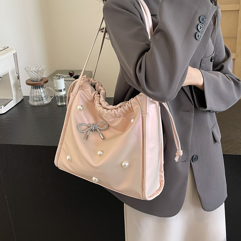 2025 autumn atmosphere New Commuter Large Capacity Women s Bag Light Luxury Elegant Pearl Bow Decorative Underarm Bag Designer Shoulder Bag
