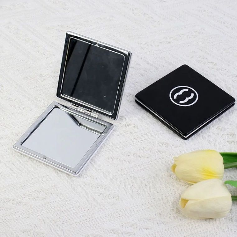 Sell 2025 luxury women's classic black letter logo makeup mirror portable foldable touch up mirror designer flip cover double-sided mini cosmetics mirror