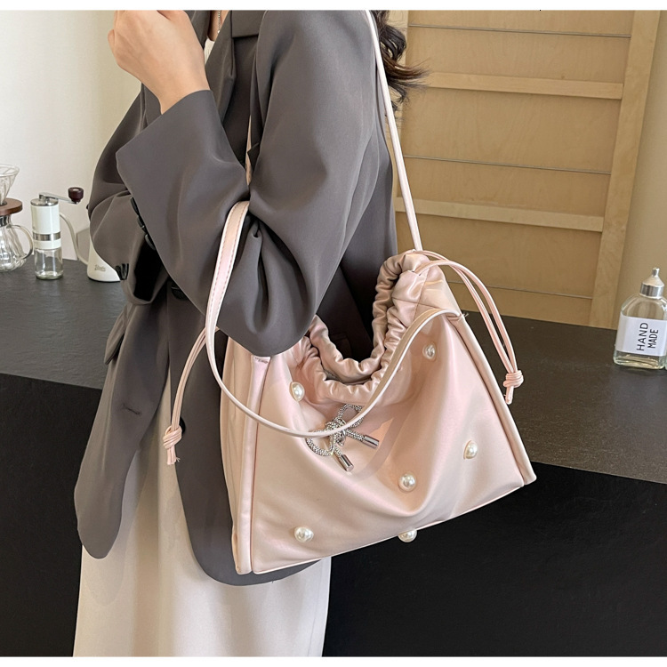 2025 autumn atmosphere New Commuter Large Capacity Women s Bag Light Luxury Elegant Pearl Bow Decorative Underarm Bag Designer Shoulder Bag