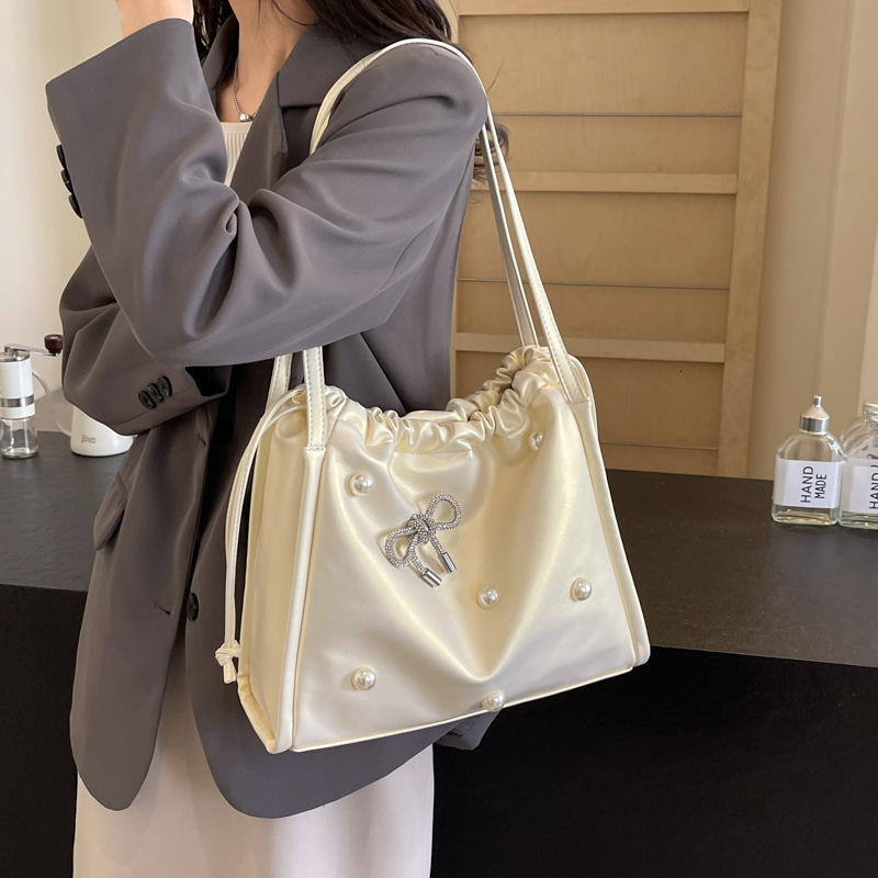 2025 autumn atmosphere New Commuter Large Capacity Women s Bag Light Luxury Elegant Pearl Bow Decorative Underarm Bag Designer Shoulder Bag