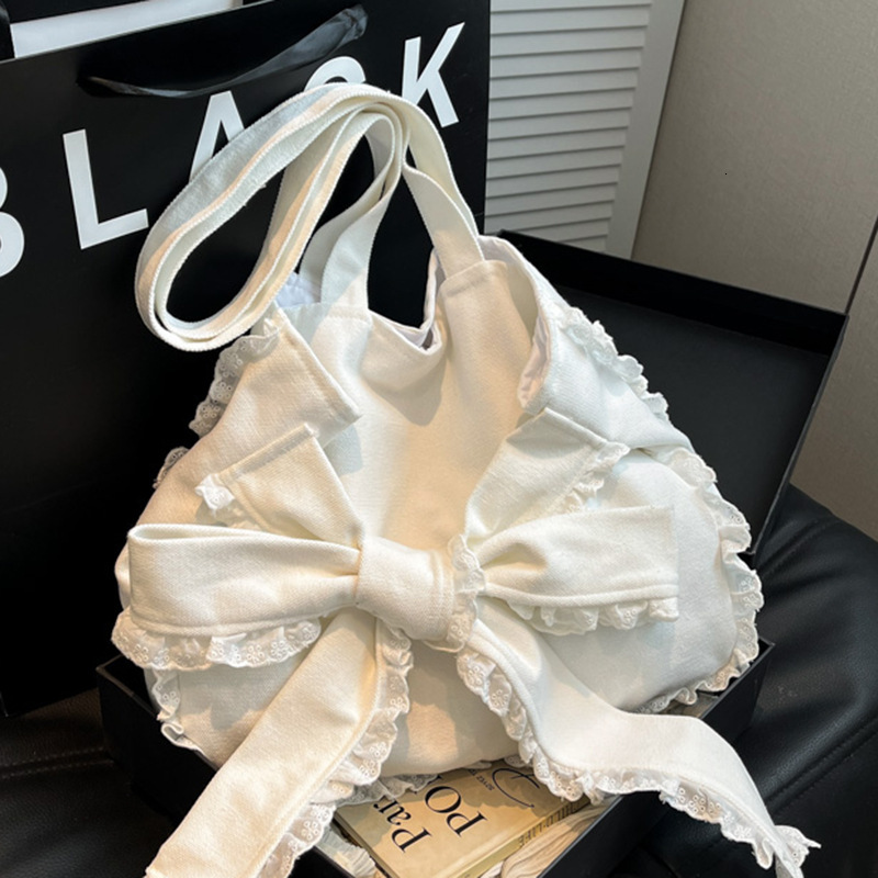 autumn new Korean sweet girl bow casual versatile simple lace handbag niche design atmosphere unique creative armpit women s bag designer shoulder bag
