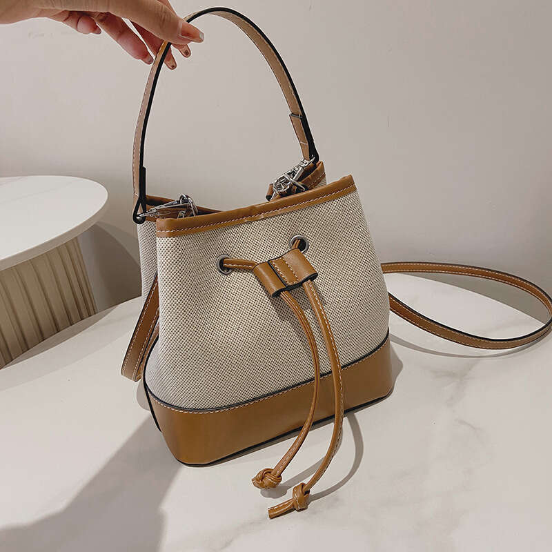 2025 Winter Niche New European Fashion Women's Bucket Bag High End Crossbody Drawstring Patchwork PU Handheld Bag