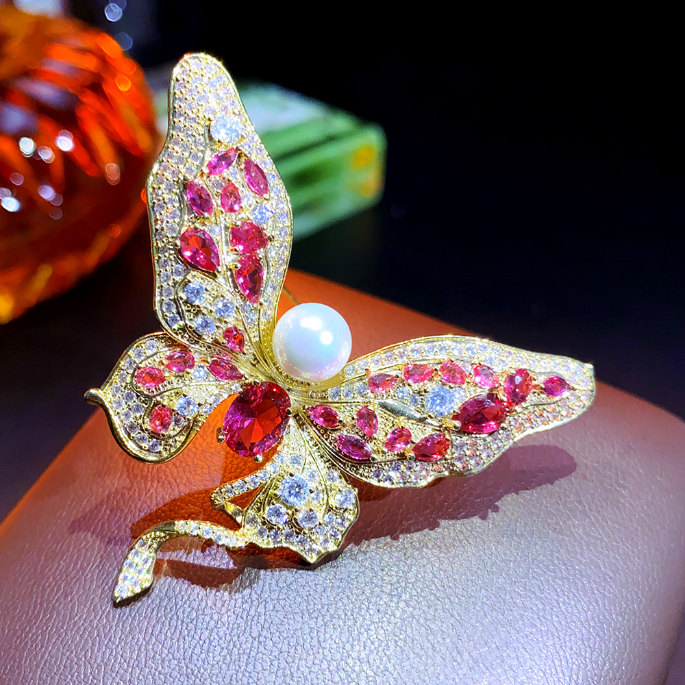 Designer Heavy duty Butterfly Shaped Brooch with Large Carat Red Zircon and Pearl Inlay, Light Luxury, Fashionable, High end and Premium Brooch