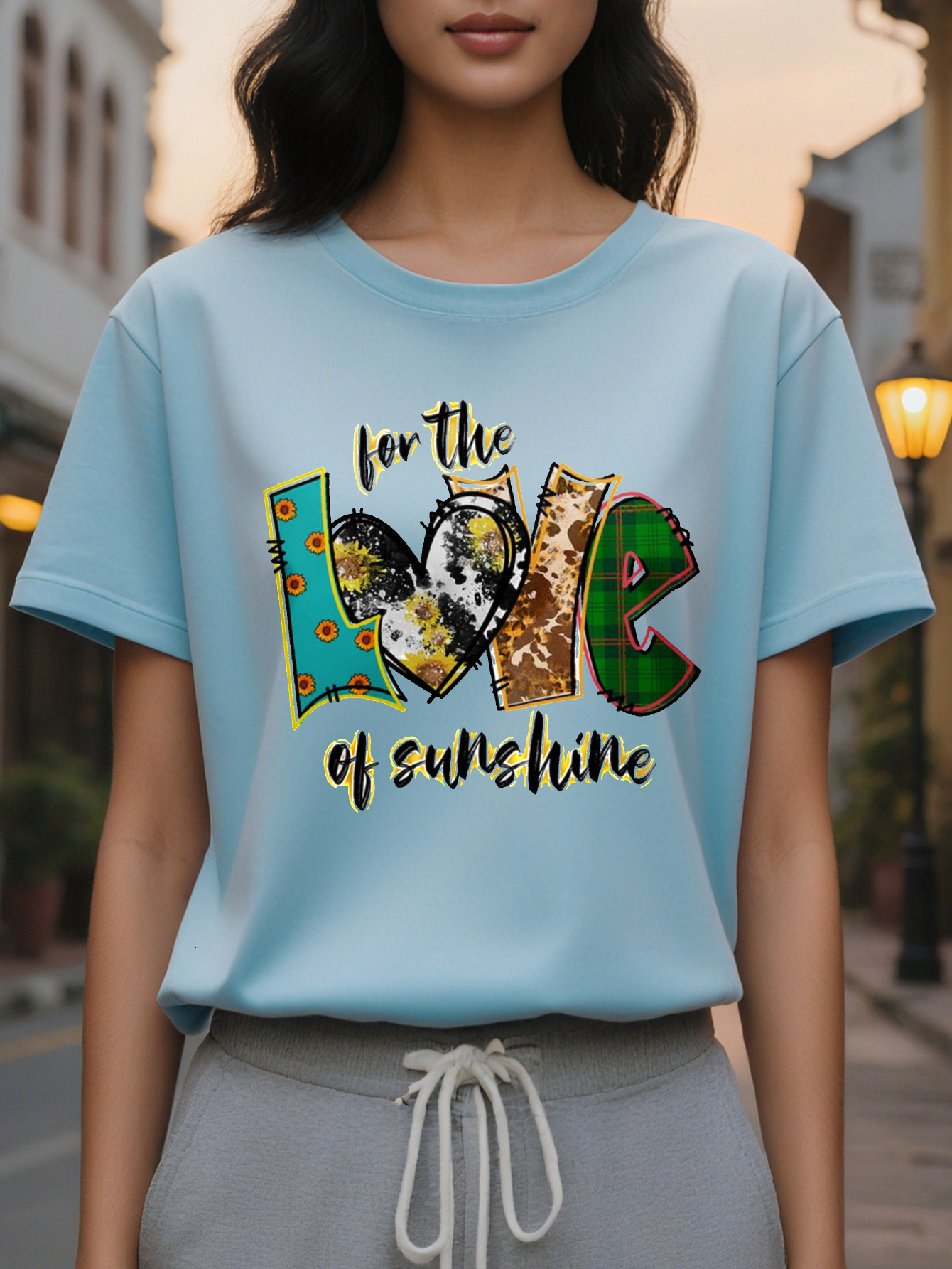 Ladies elegant sweater white jacket with the words "love sunshine" printed on it, mid-stretch shirt folded in autumn