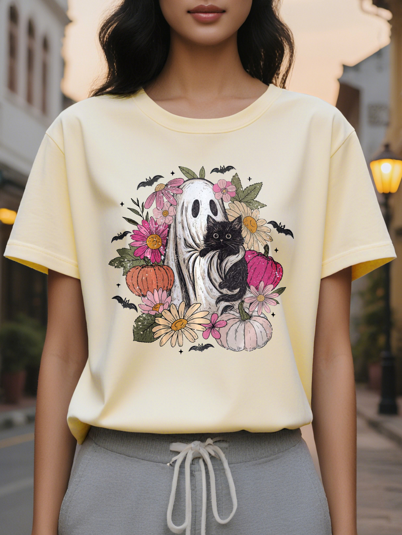 Women s elegant white short sleeved T shirt with black cat flower bat print, round neck summer top in soft pale pink and green