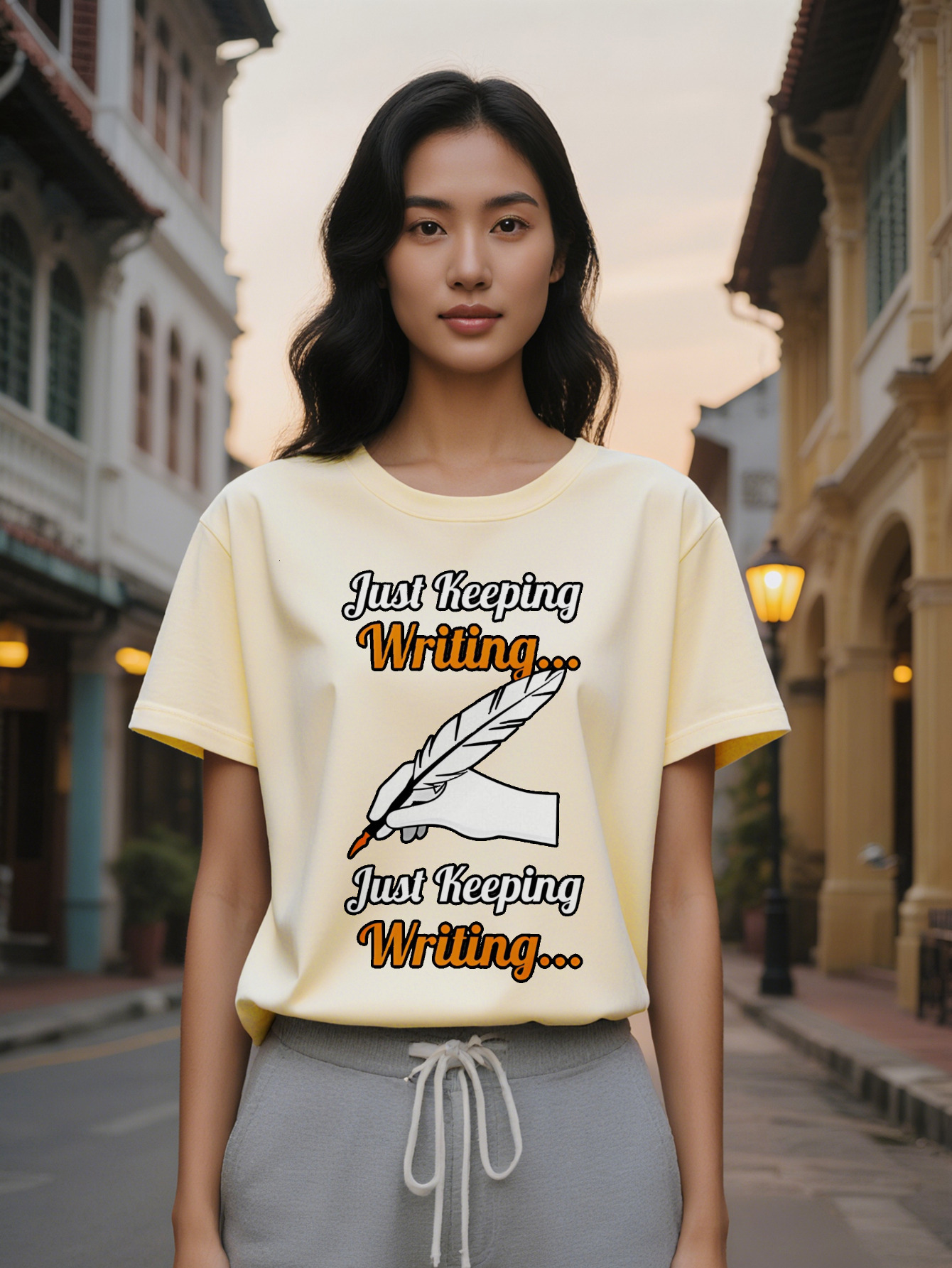 Large XL Women's Casual Short Sleeve T-Shirt Handwritten Feather Quill Just Keeping Writing Print Black with Orange Lettering Plus Size