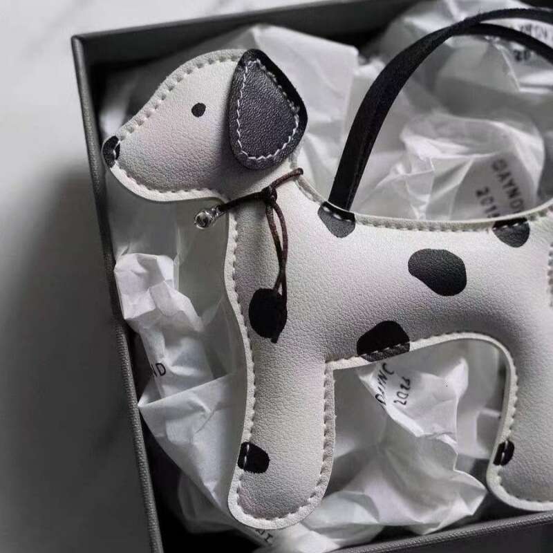 DHEssentials 2025 Spotted Pup Charm, PU Leather Dog Mascot, Cute Keychain Pendant