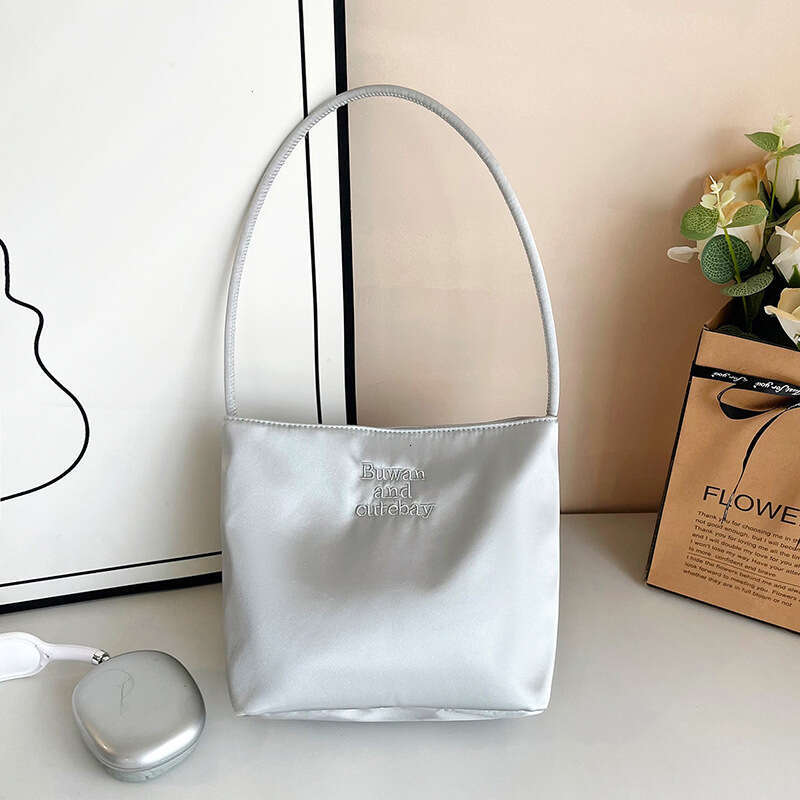 2025 Summer New Simple Nylon Underarm Korean Niche Design Letter Embroidery Handheld Commuter Bucket Bag