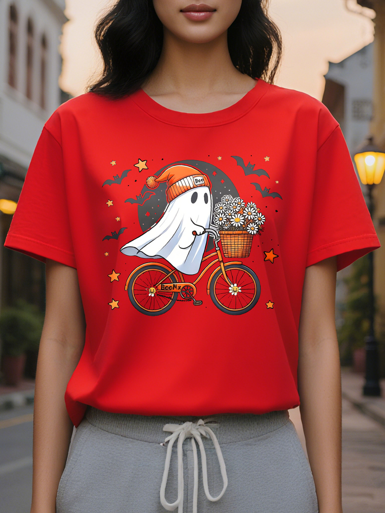 Women Graphic Tee Cute Ghost Riding Bike with Floral Basket Black Orange Design Casual Round Neck T-Shirt for
