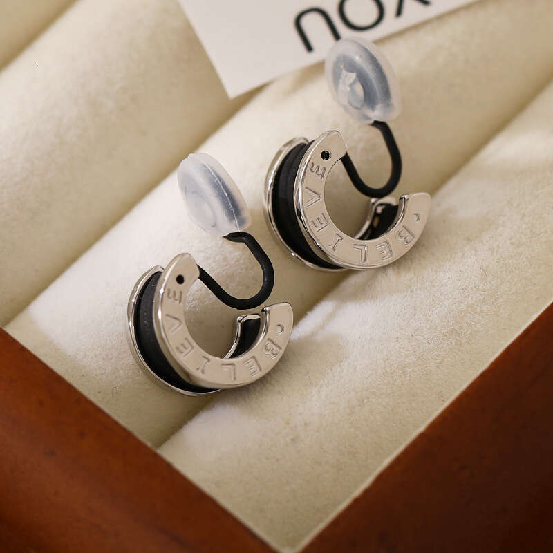 DH collections New Arrival! Women's Stylish Black Tweed - inspired Ear Clips & Earrings. Exude a touch of luxury with this trendy design.