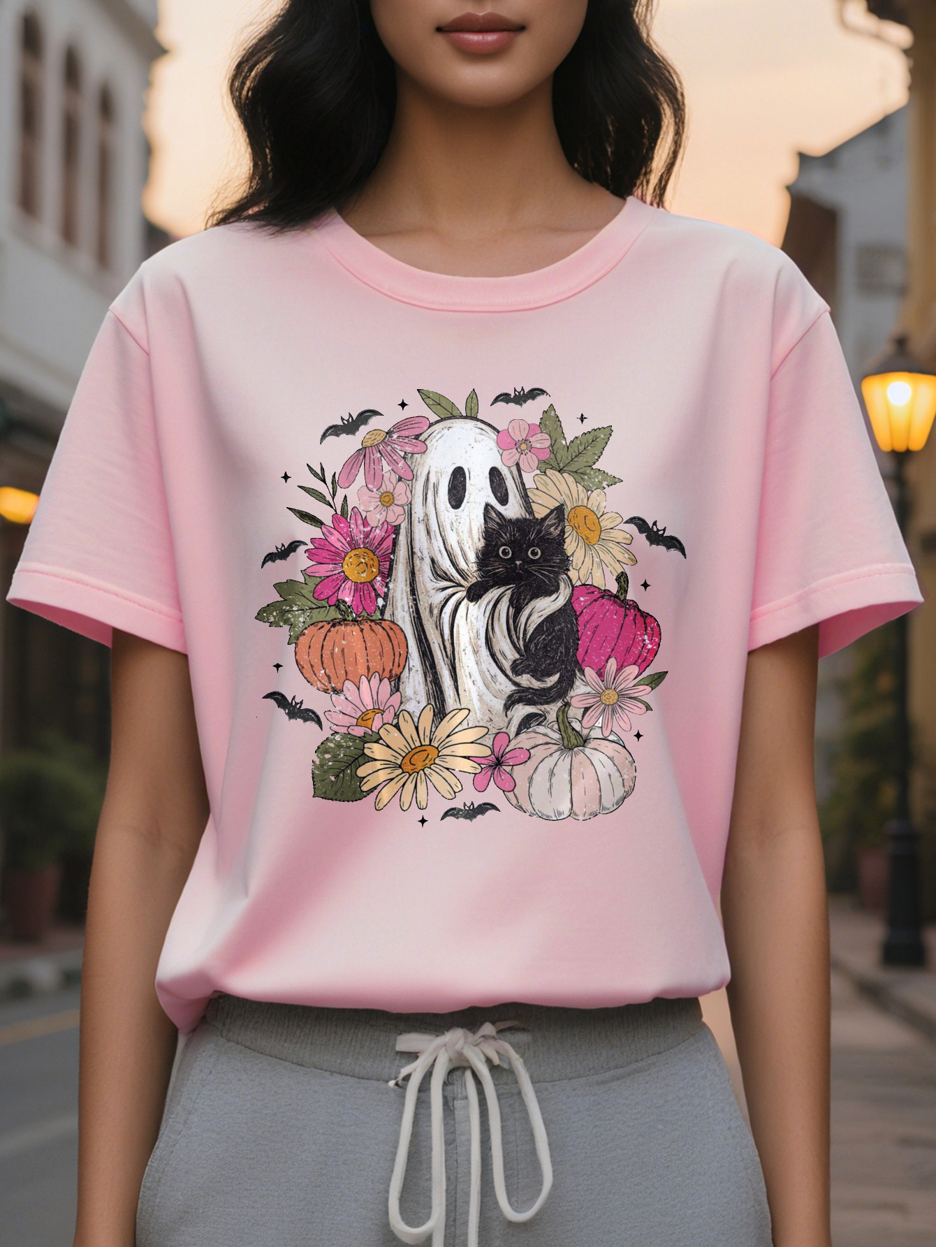 Women s elegant white short sleeved T shirt with black cat flower bat print, round neck summer top in soft pale pink and green