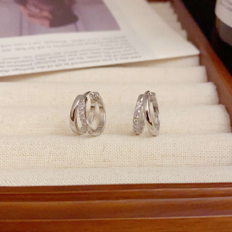 DH collections Stylish S999 Sterling Silver Double - layer Hollowed Ear Cuffs. These trendy Korean - style earrings feature a geometric design