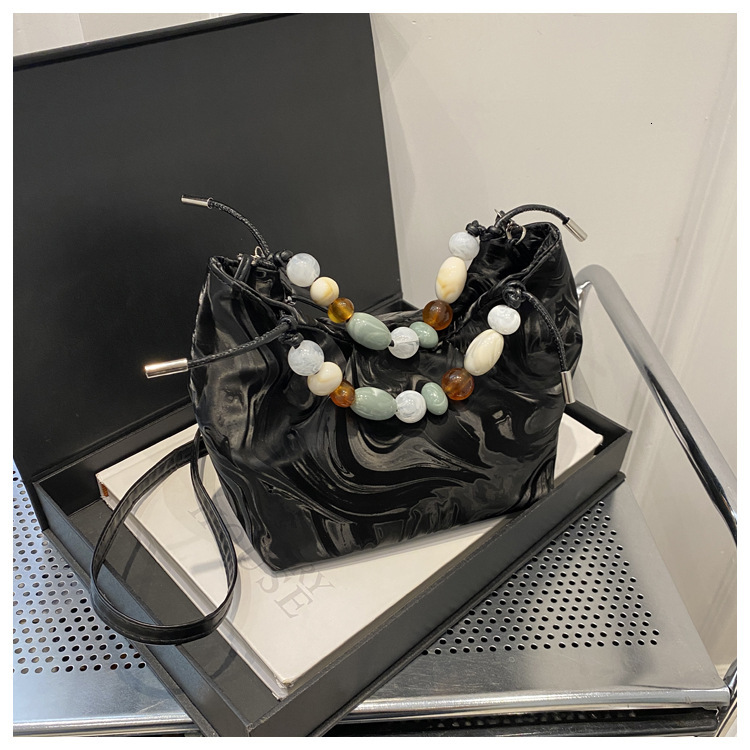 2025 autumn new women's handbag fashion versatile, light luxury elegant niche design bucket bag pearl crossbody bag designer shoulder bag