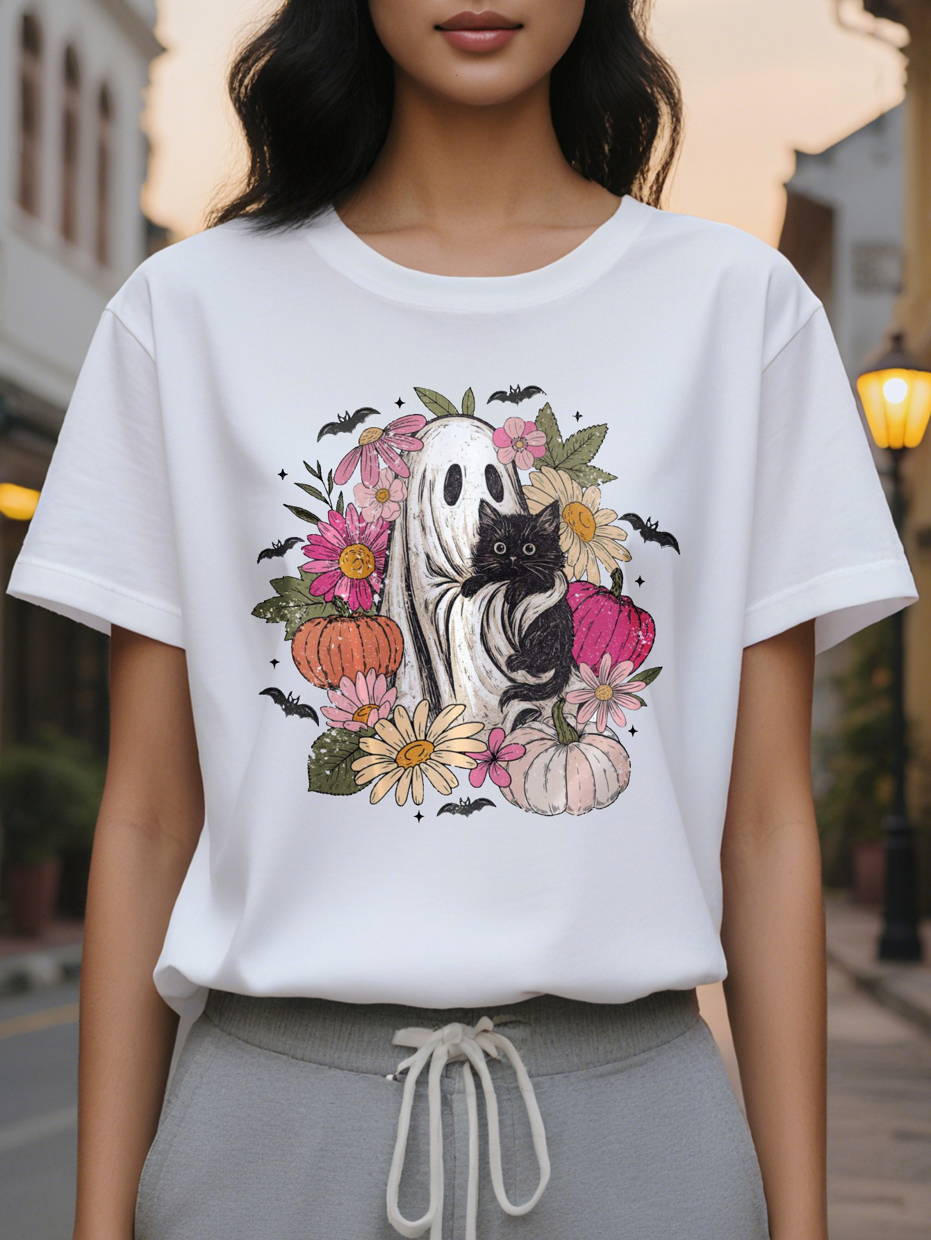 Women s elegant white short sleeved T shirt with black cat flower bat print, round neck summer top in soft pale pink and green