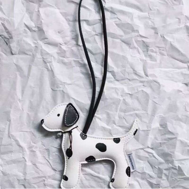 DHEssentials 2025 Spotted Pup Charm, PU Leather Dog Mascot, Cute Keychain Pendant