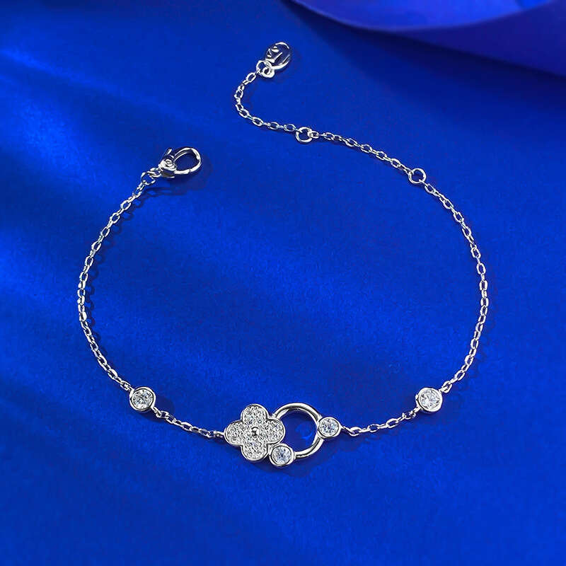 DH collections 925 Sterling Silver Lucky Four - leaf Clover Bracelet. This delicate and luxurious bracelet features trendy elements like row - set dia
