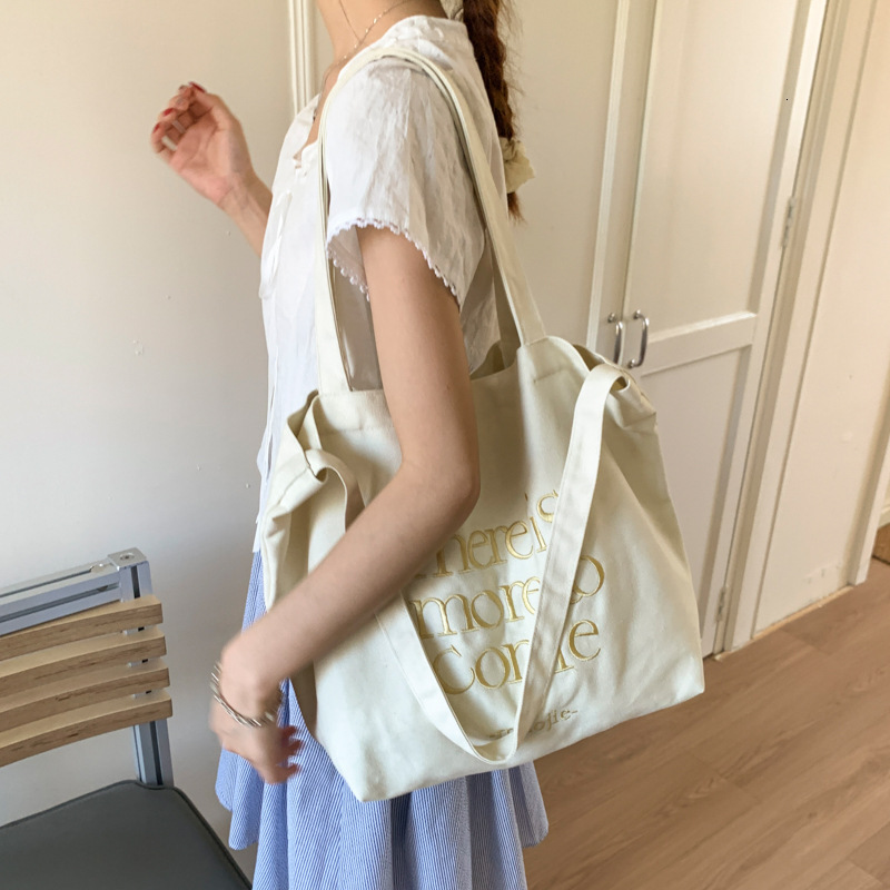 2025 autumn new bag letter embroidered canvas bag large capacity handbag Korean casual commuting bag student shoulder bag fashion designer crossbody b