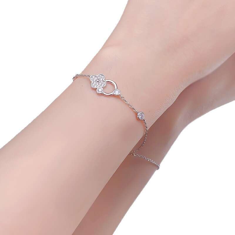 DH collections 925 Sterling Silver Lucky Four - leaf Clover Bracelet. This delicate and luxurious bracelet features trendy elements like row - set dia
