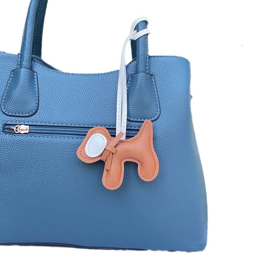 DHEssentials 2025 Spring Leather Bow Dog Pendant Cartoon Bag Charm PU Keychain Car Hanger White Customizable