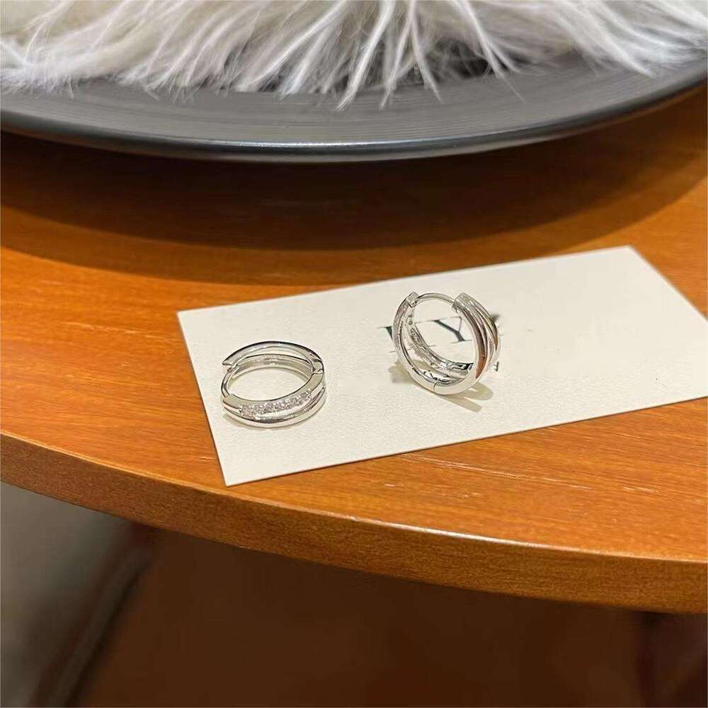 DH collections Stylish S999 Sterling Silver Double - layer Hollowed Ear Cuffs. These trendy Korean - style earrings feature a geometric design