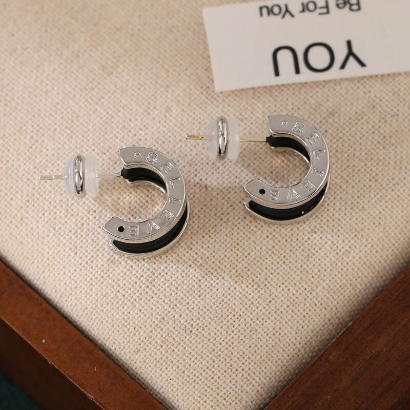 DH collections New Arrival! Women's Stylish Black Tweed - inspired Ear Clips & Earrings. Exude a touch of luxury with this trendy design.