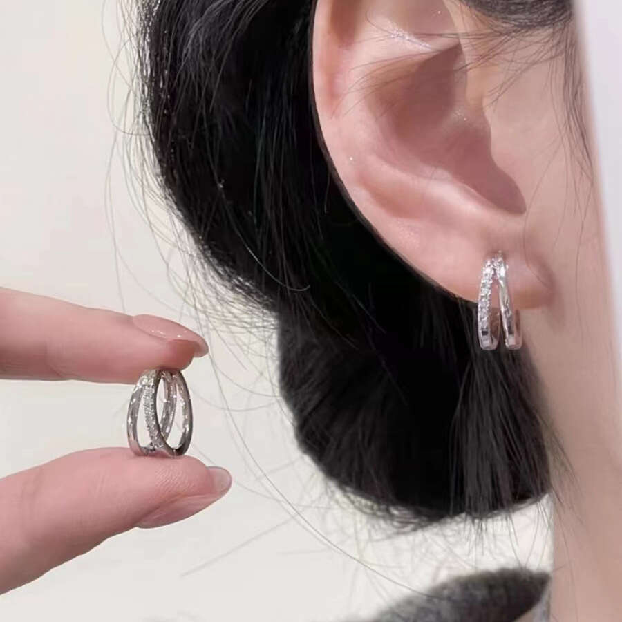 DH collections Stylish S999 Sterling Silver Double - layer Hollowed Ear Cuffs. These trendy Korean - style earrings feature a geometric design