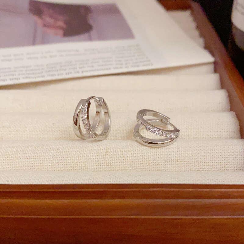 DH collections Stylish S999 Sterling Silver Double - layer Hollowed Ear Cuffs. These trendy Korean - style earrings feature a geometric design