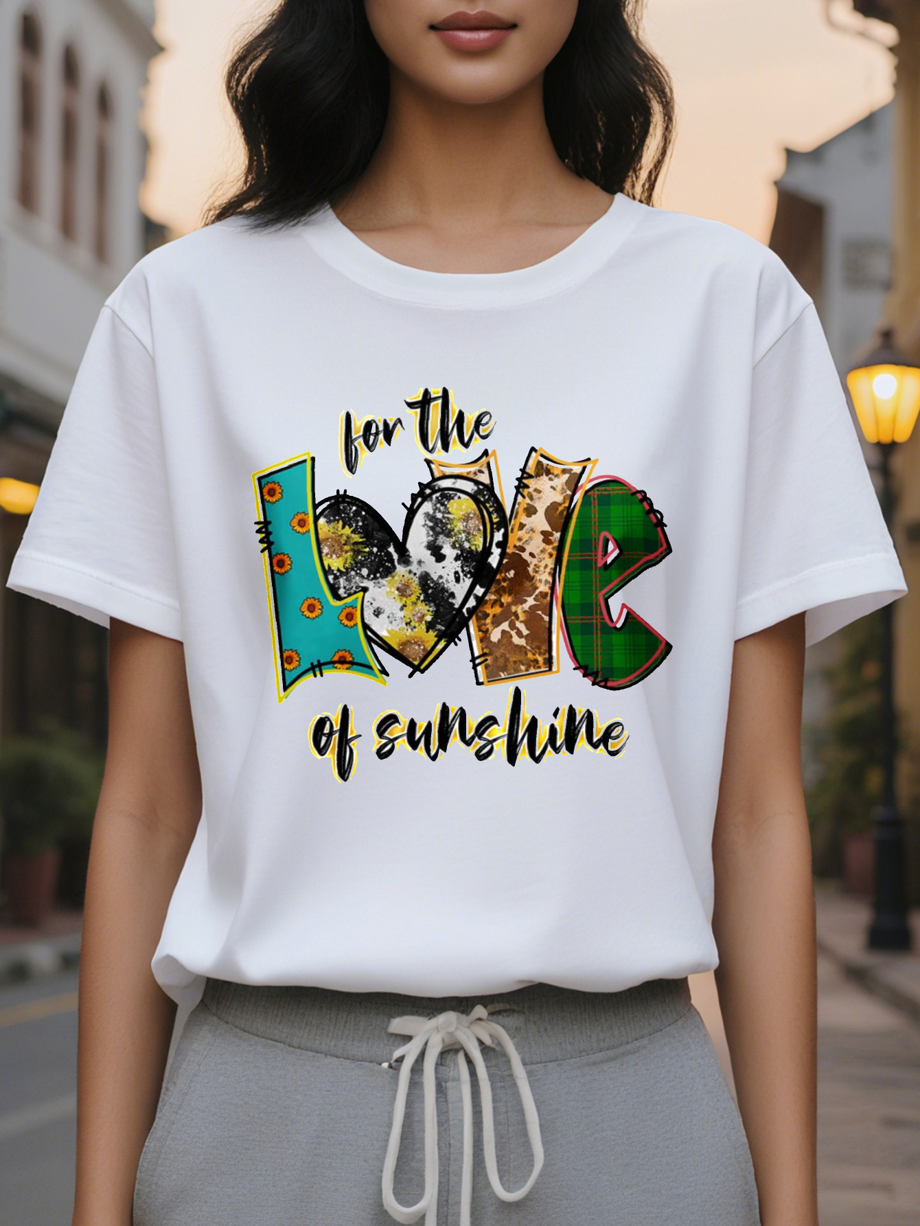 Ladies elegant sweater white jacket with the words "love sunshine" printed on it, mid-stretch shirt folded in autumn
