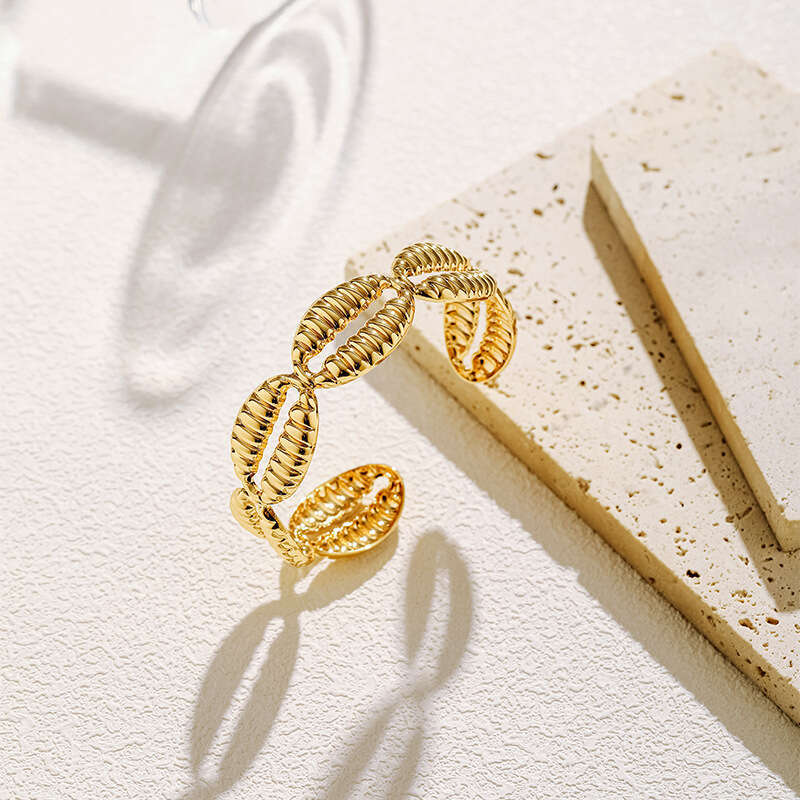 DH collections Vintage - style 18K Gold - plated Copper Bracelet with Shell Design. This bracelet in a geometric shape offers a retro and laid - back 