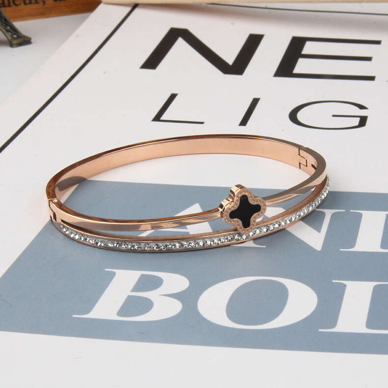 DH collections European - American Style Stainless Steel Single - row Diamond - inlaid Bracelet. This rose - gold four - leaf - clover titanium