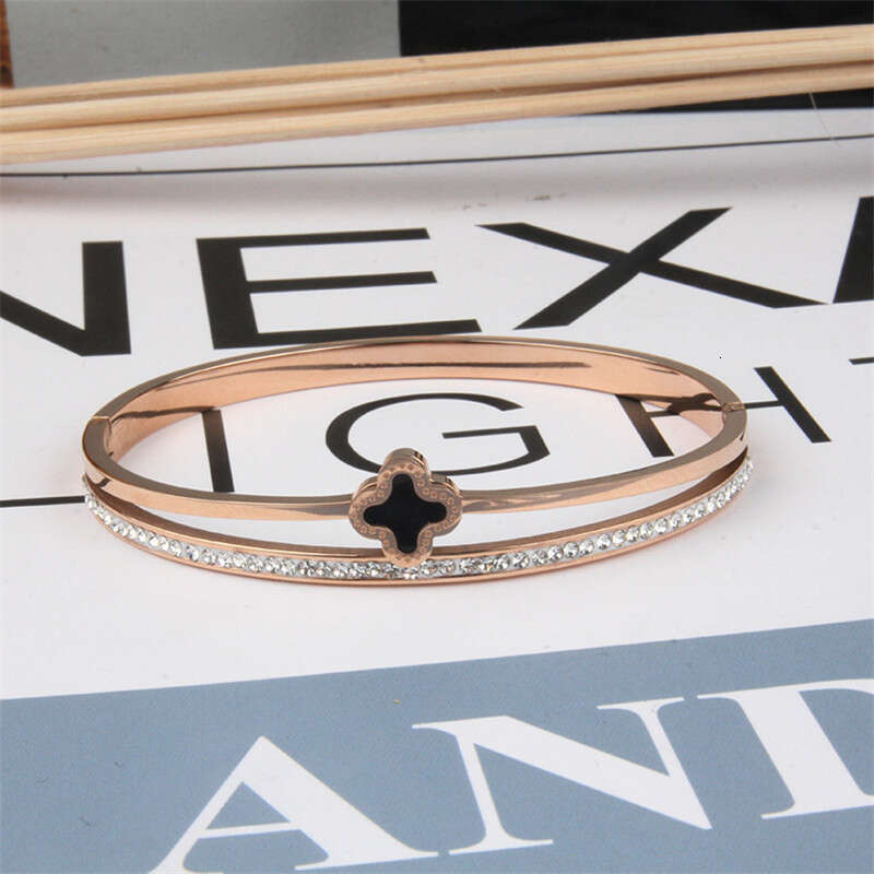 DH collections European - American Style Stainless Steel Single - row Diamond - inlaid Bracelet. This rose - gold four - leaf - clover titanium