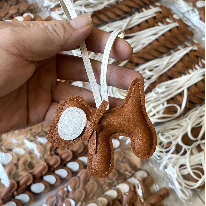 DHEssentials 2025 Spring Leather Bow Dog Pendant Cartoon Bag Charm PU Keychain Car Hanger White Customizable